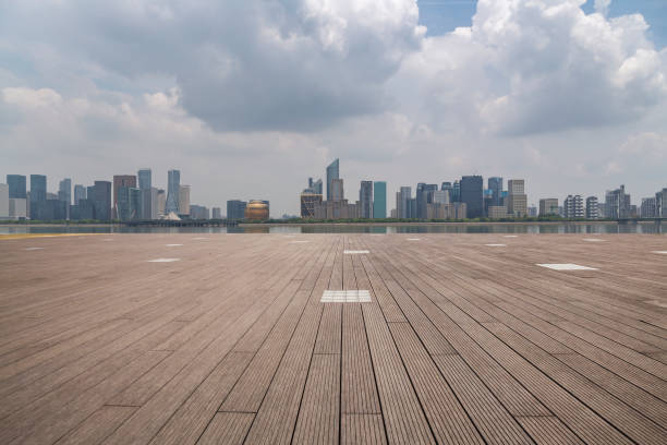 istock Panoramic skyline and modern business office buildings with empty road,empty concrete square floor 972391468
