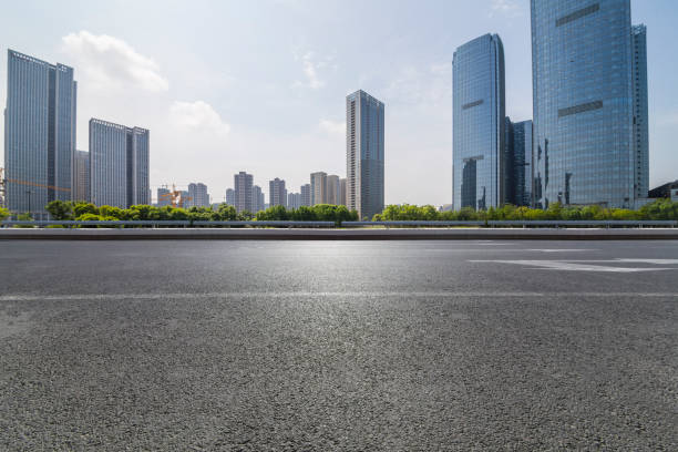 istock Panoramic skyline and modern business office buildings with empty road,empty concrete square floor 972391470