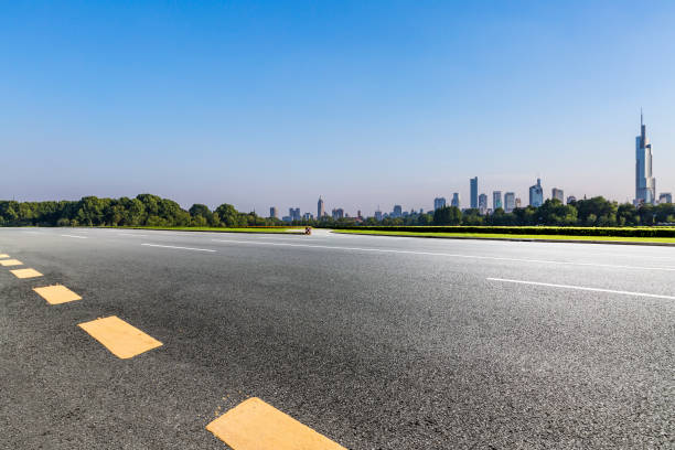 istock Panoramic skyline and modern business office buildings with empty road,empty concrete square floor 972391502
