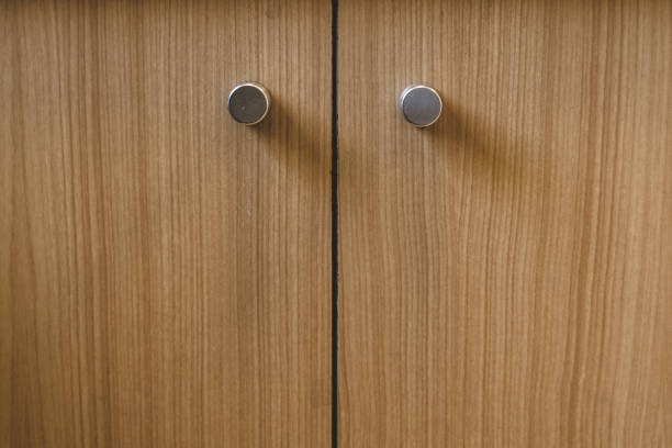 istock Cupboard doors with round handles with wood veneer finish 972391506