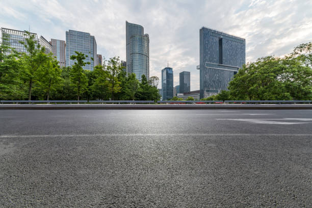 istock Panoramic skyline and modern business office buildings with empty road,empty concrete square floor 972393780