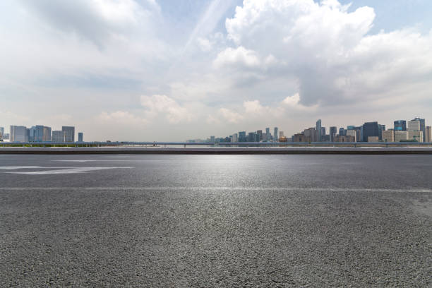 istock Panoramic skyline and modern business office buildings with empty road,empty concrete square floor 972393782