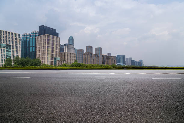 istock Panoramic skyline and modern business office buildings with empty road,empty concrete square floor 972397978
