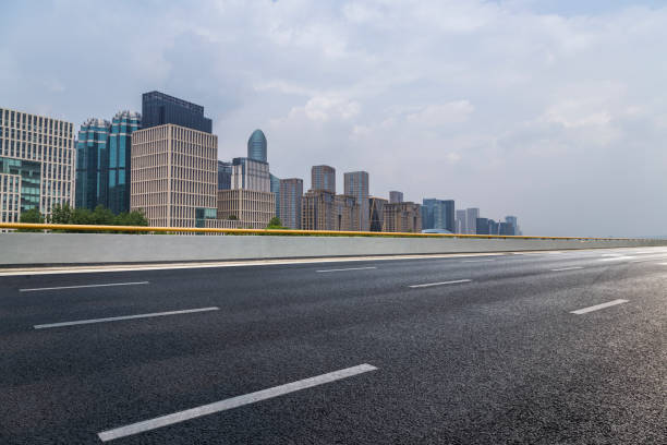istock Panoramic skyline and modern business office buildings with empty road,empty concrete square floor 972398038