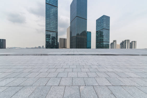 istock Panoramic skyline and modern business office buildings with empty road,empty concrete square floor 972398180