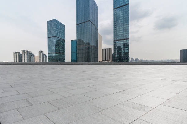 istock Panoramic skyline and modern business office buildings with empty road,empty concrete square floor 972398244