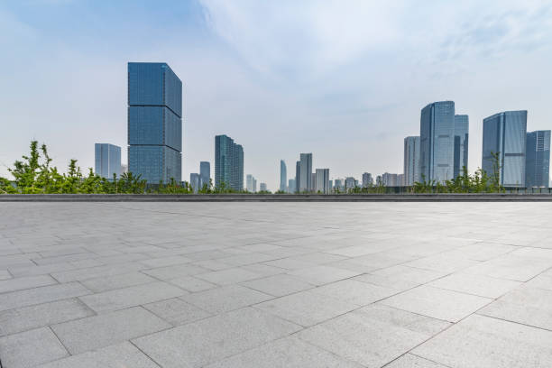 istock Panoramic skyline and modern business office buildings with empty road,empty concrete square floor 972400648