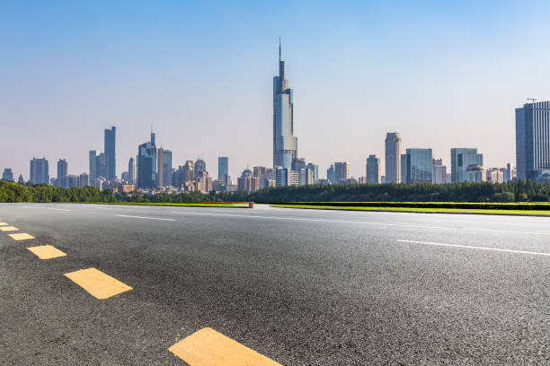 istock Panoramic skyline and modern business office buildings with empty road,empty concrete square floor 972405062