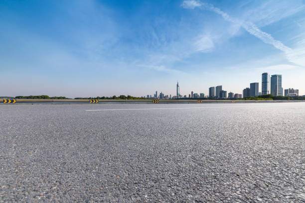 istock Panoramic skyline and modern business office buildings with empty road,empty concrete square floor 972405318