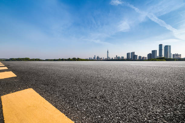 istock Panoramic skyline and modern business office buildings with empty road,empty concrete square floor 972405334