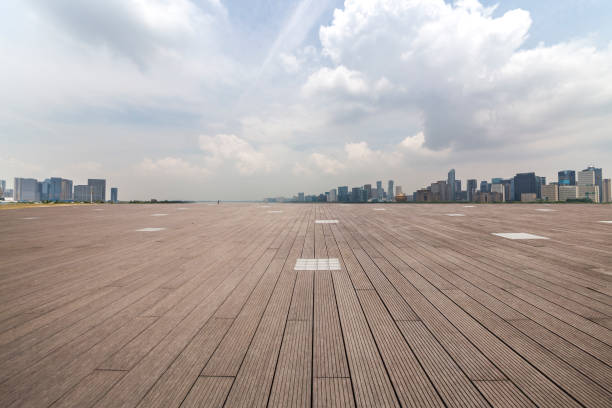 istock Panoramic skyline and modern business office buildings with empty road,empty concrete square floor 972413178