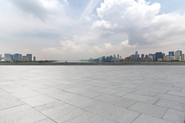 istock Panoramic skyline and modern business office buildings with empty road,empty concrete square floor 972413204