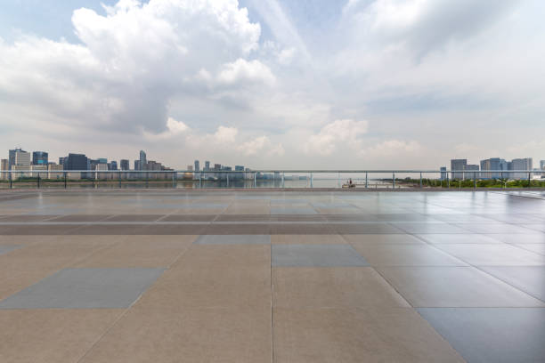 istock Panoramic skyline and modern business office buildings with empty road,empty concrete square floor 972414702