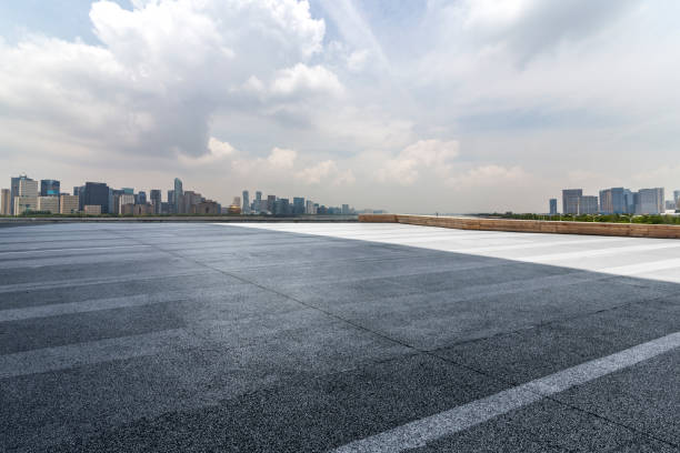 istock Panoramic skyline and modern business office buildings with empty road,empty concrete square floor 972414720