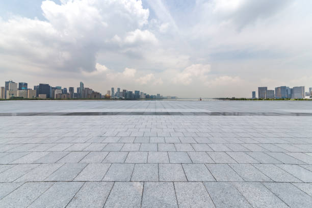 istock Panoramic skyline and modern business office buildings with empty road,empty concrete square floor 972414726