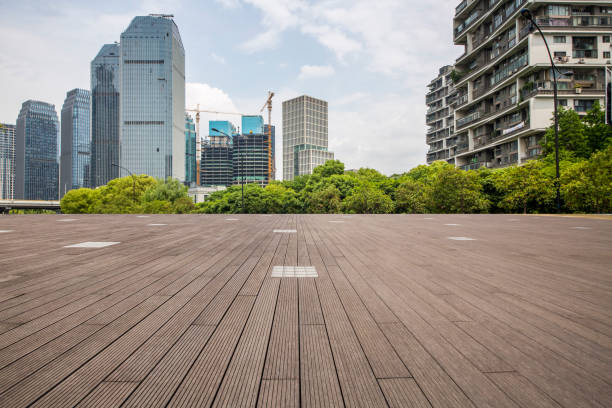 istock Panoramic skyline and modern business office buildings with empty road,empty concrete square floor 972414812