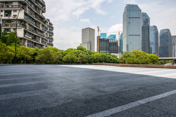 istock Panoramic skyline and modern business office buildings with empty road,empty concrete square floor 972414852
