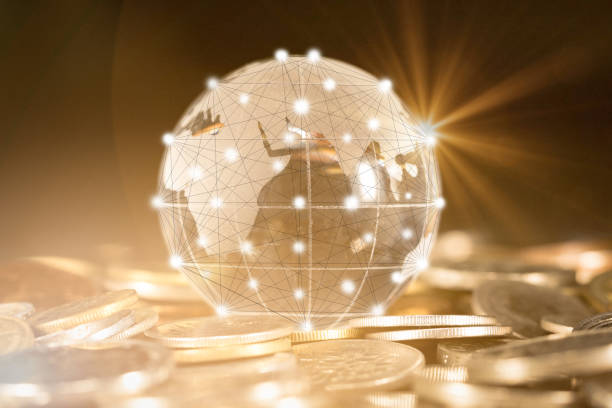 istock Closed up of world ball with stroke path and connection points put on internation coins. business concept. 972415194