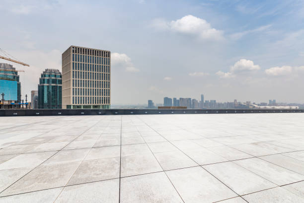 istock Panoramic skyline and modern business office buildings with empty road,empty concrete square floor 972415196