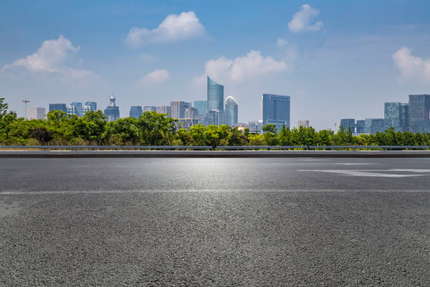 istock Panoramic skyline and modern business office buildings with empty road,empty concrete square floor 972415316