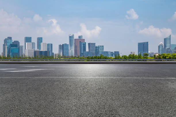 istock Panoramic skyline and modern business office buildings with empty road,empty concrete square floor 972417440