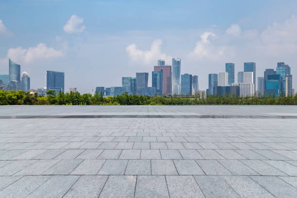 istock Panoramic skyline and modern business office buildings with empty road,empty concrete square floor 972417442