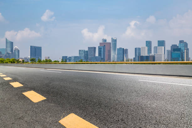 istock Panoramic skyline and modern business office buildings with empty road,empty concrete square floor 972417456