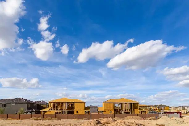 New single family residences being built in Phoenix, Arizona under a beautiful sky.