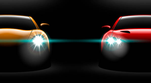 istock realistic red yellow two sport car view with unlocked headlights in the dark 972420156