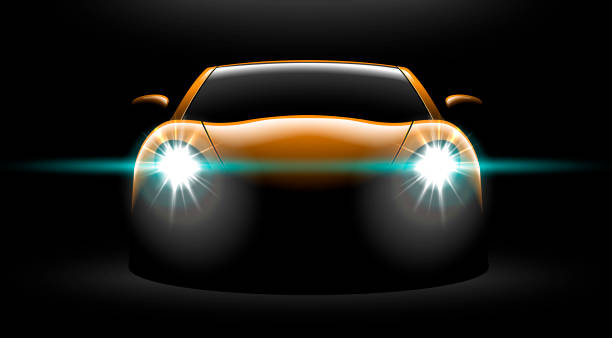 istock realistic yellow sport car view with unlocked headlights in the dark 972420158
