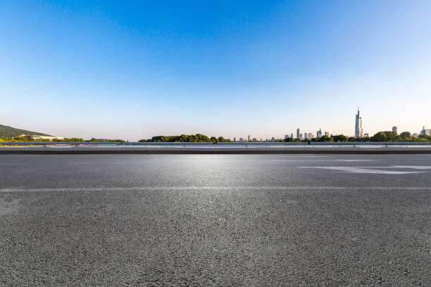 istock Panoramic skyline and modern business office buildings with empty road,empty concrete square floor 972420480