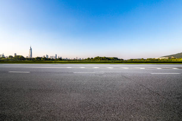 istock Panoramic skyline and modern business office buildings with empty road,empty concrete square floor 972420536