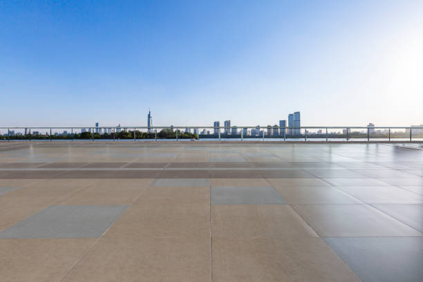 istock Panoramic skyline and modern business office buildings with empty road,empty concrete square floor 972420576