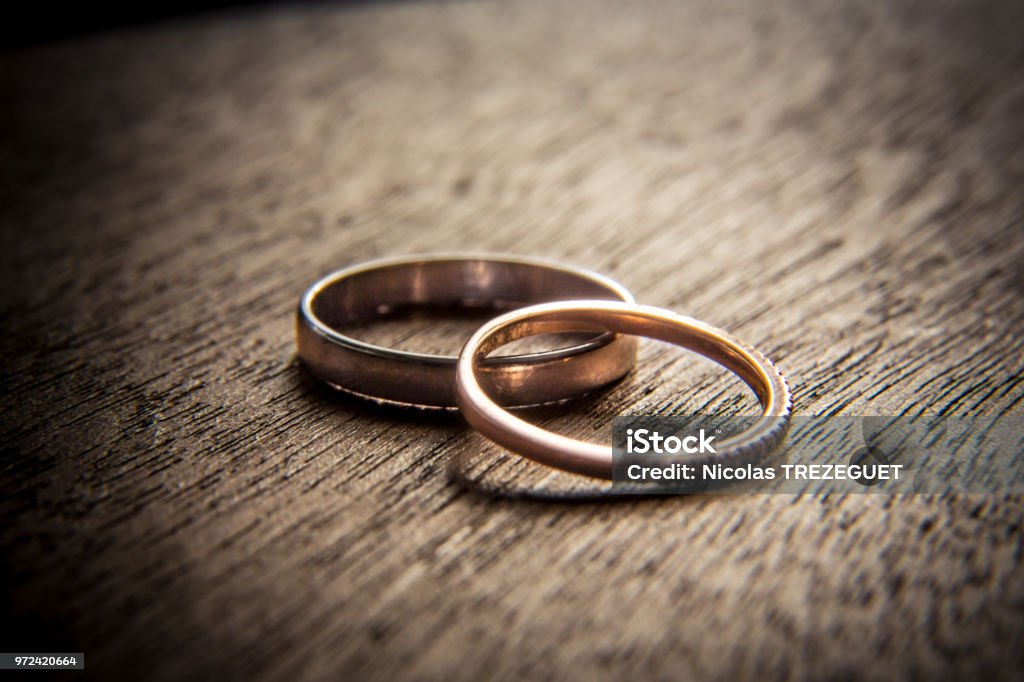 Wedding rings on wood Wedding Stock Photo