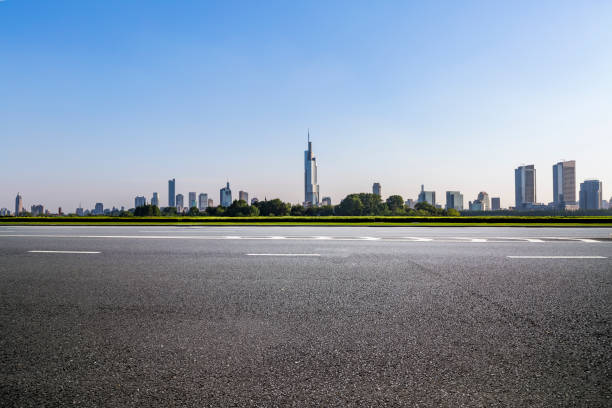 istock Panoramic skyline and modern business office buildings with empty road,empty concrete square floor 972423118