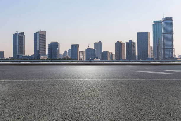istock Panoramic skyline and modern business office buildings with empty road,empty concrete square floor 972423184