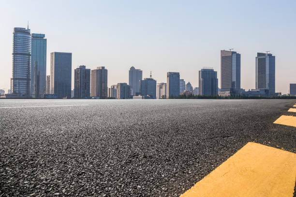 istock Panoramic skyline and modern business office buildings with empty road,empty concrete square floor 972423188