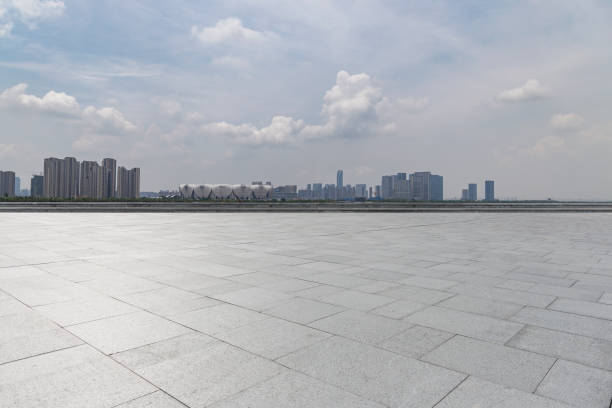 istock Panoramic skyline and modern business office buildings with empty road,empty concrete square floor 972423360