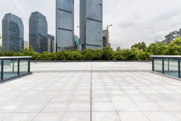 istock Panoramic skyline and modern business office buildings with empty road,empty concrete square floor 972423426