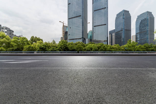 istock Panoramic skyline and modern business office buildings with empty road,empty concrete square floor 972423448