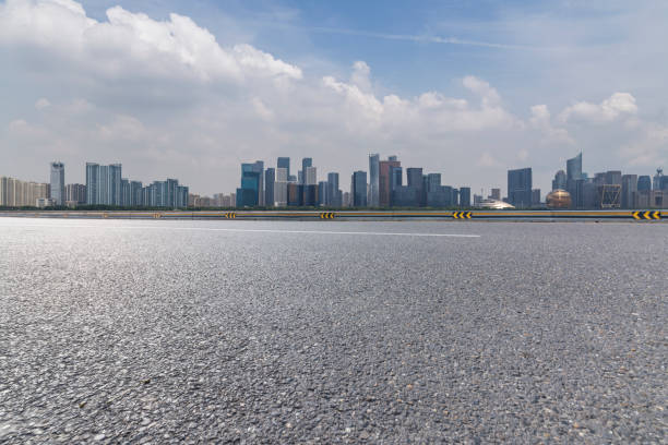 istock Panoramic skyline and modern business office buildings with empty road,empty concrete square floor 972425500