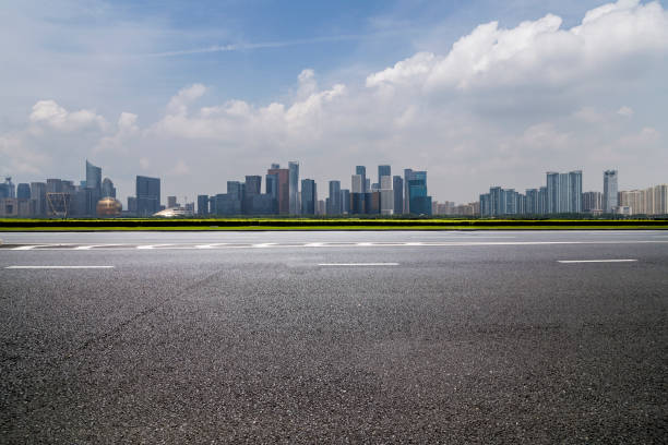 istock Panoramic skyline and modern business office buildings with empty road,empty concrete square floor 972425518