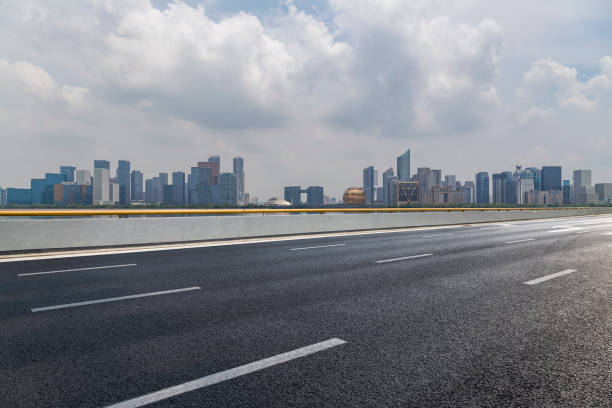 istock Panoramic skyline and modern business office buildings with empty road,empty concrete square floor 972425756