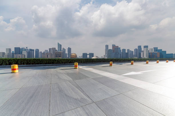 istock Panoramic skyline and modern business office buildings with empty road,empty concrete square floor 972425814