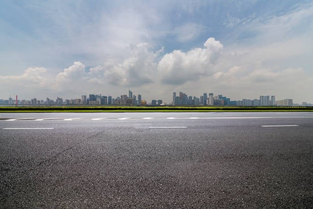 istock Panoramic skyline and modern business office buildings with empty road,empty concrete square floor 972425904
