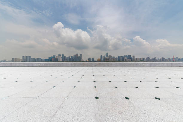 istock Panoramic skyline and modern business office buildings with empty road,empty concrete square floor 972425918