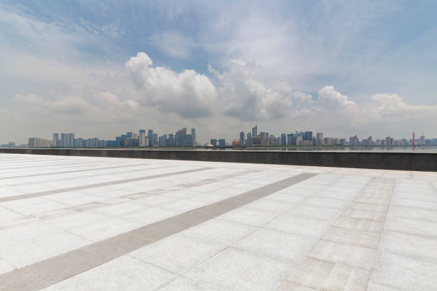 istock Panoramic skyline and modern business office buildings with empty road,empty concrete square floor 972425954
