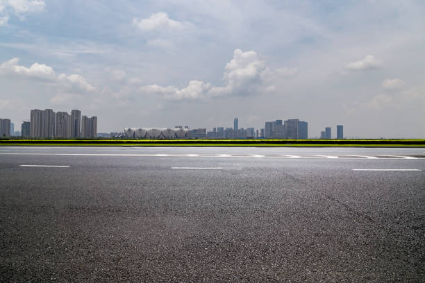 istock Panoramic skyline and modern business office buildings with empty road,empty concrete square floor 972426158