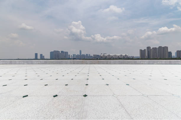 istock Panoramic skyline and modern business office buildings with empty road,empty concrete square floor 972426170