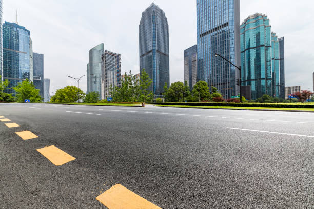 istock Panoramic skyline and modern business office buildings with empty road,empty concrete square floor 972444686